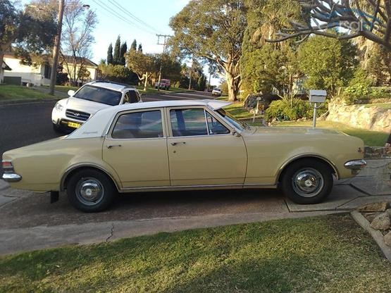 HT Holden in Kashmir White over Pharoah Gold — Kingswood Sedan