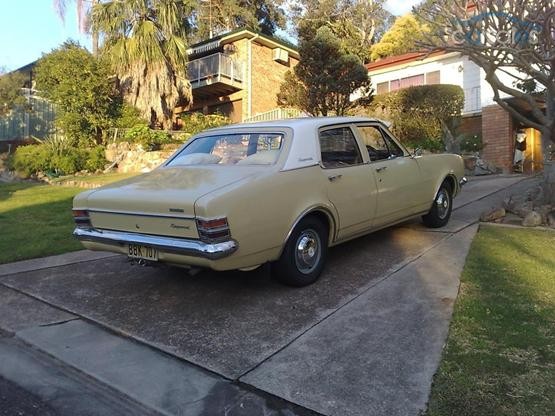HT Holden in Kashmir White over Pharoah Gold — Kingswood Sedan