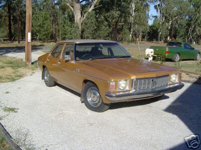 HX Holden in Antelope Met over Contessa Gold Met — Kingswood Sedan