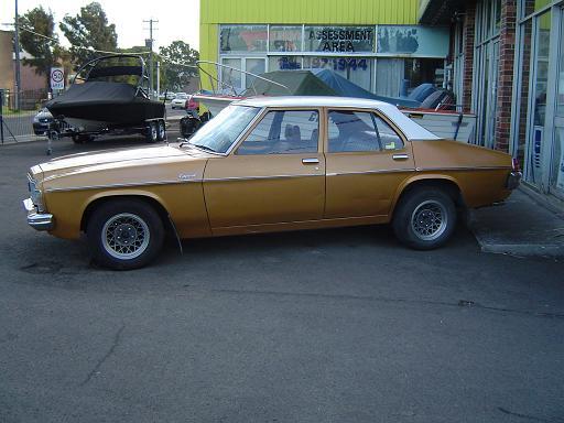 HX Holden in Cotillion White over Contessa Gold Met — Kingswood Sedan