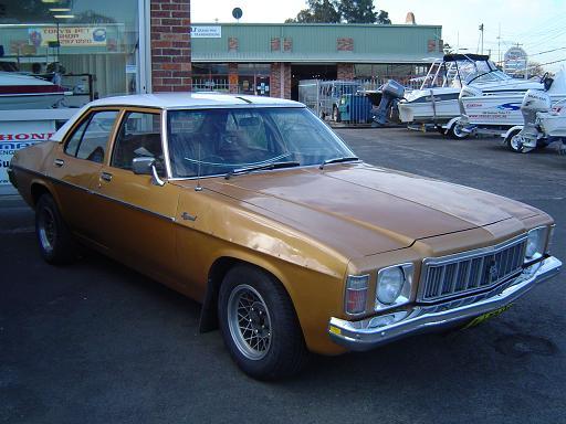 HX Holden in Cotillion White over Contessa Gold Met — Kingswood Sedan