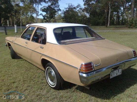 HX Holden in Cotillion White over Durham Beige — Kingswood Sedan