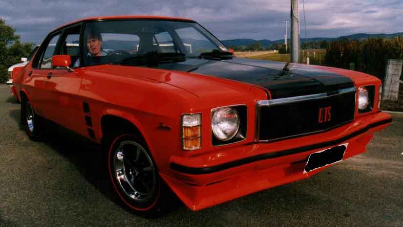 HX Holden in Mandarin Red — Monaro GTS Sedan