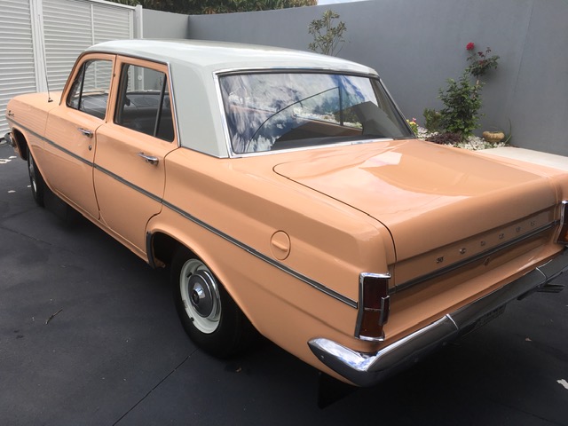 EH Holden in Fowlers Ivory over Quandong (peach) — Special Sedan