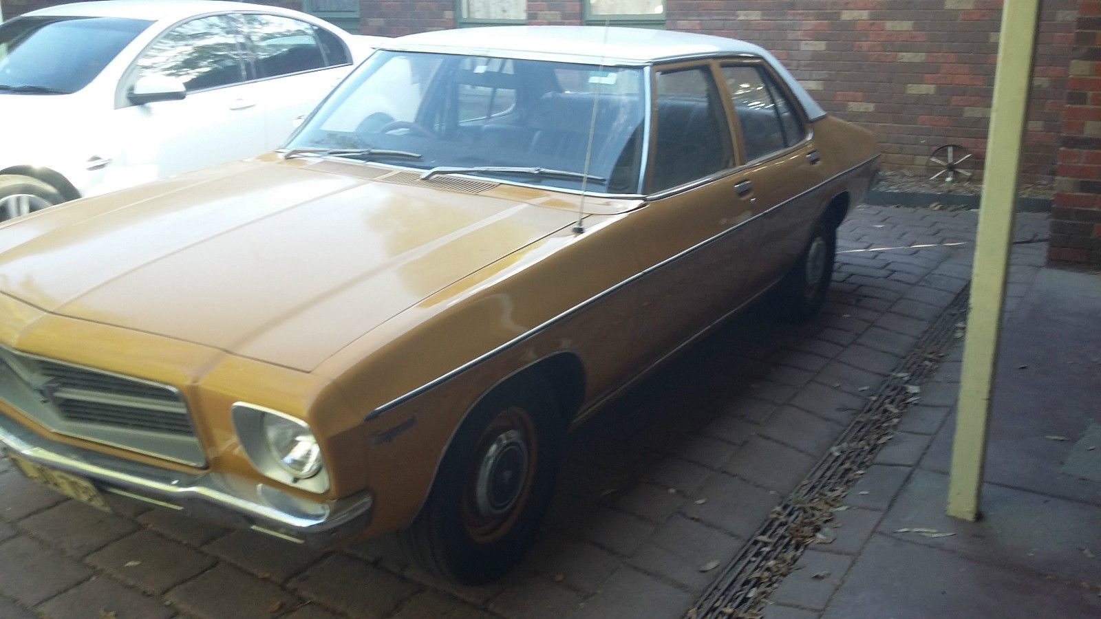 HQ Holden in Glacier White over San Remo Gold — Kingswood Sedan