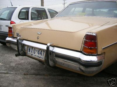HX Holden in Sierra Tan Met over Buckskin — Statesamn Caprice Sedan