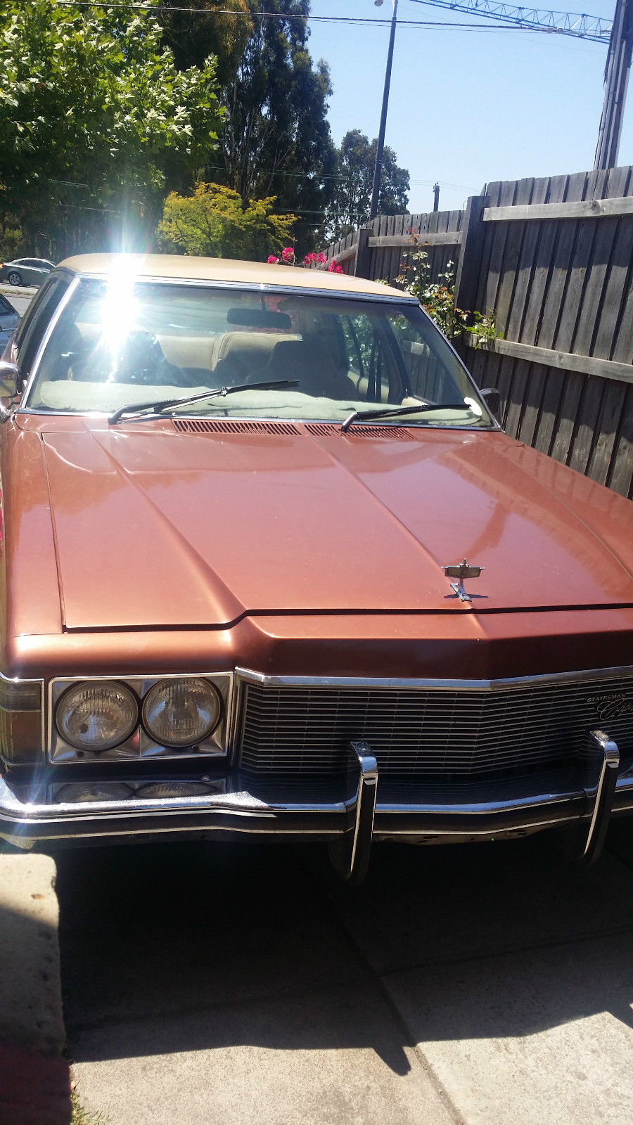 HX Holden in Grecian White over Cordovan — Statesamn Caprice Sedan