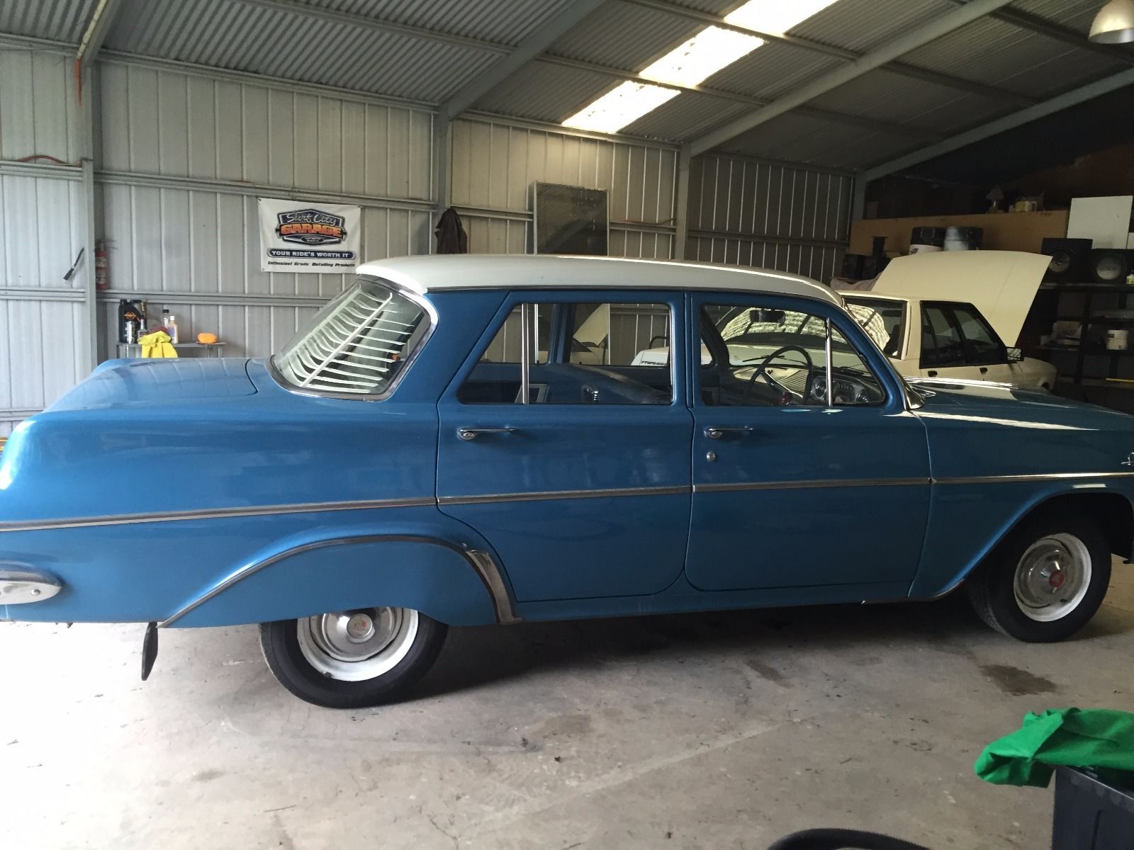 EJ Holden in Atherton Ivory over Swan River Blue — Special Sedan