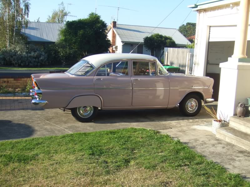 EK Holden in Snowcrest White over Cameo Beige — Special Sedan