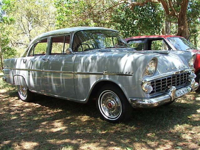 EK Holden in Snowcrest White over Montana Grey — Special Sedan