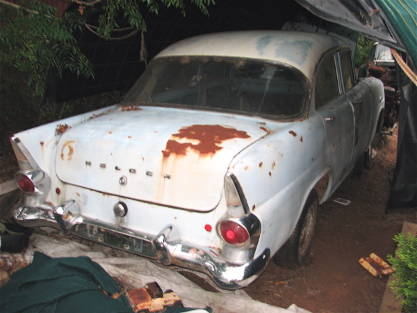 EK Holden in Snowcrest White over Strata Blue — Special Sedan