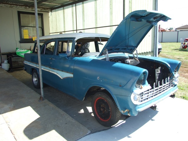 EK Holden in Snowcrest White over Argosy Turquoise — Special Station Sedan