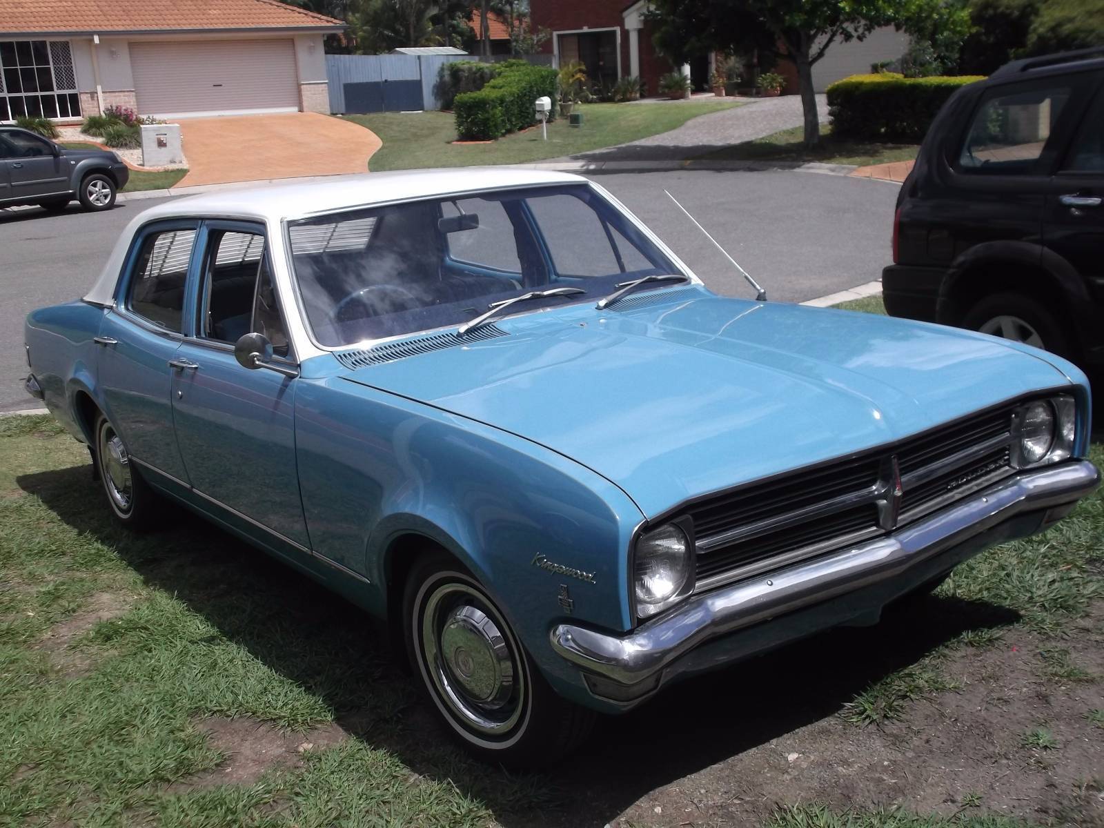 HK Holden in Ermine White over Mako Blue — Kingswood  Sedan
