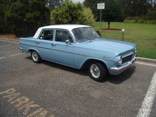 EH Holden in Fowlers Ivory over Barwon Blue — Special Sedan