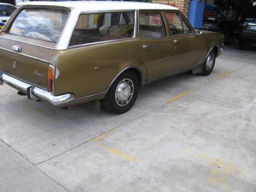 HT Holden in Kashmir White over Egyptian Bronze Met — Belmont Station Sedan