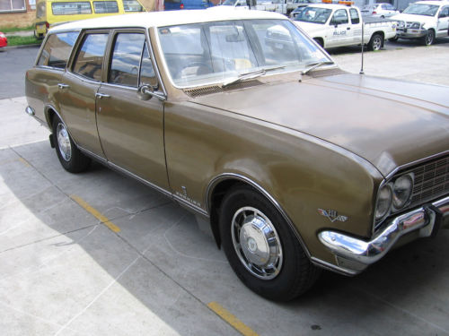 HT Holden in Kashmir White over Egyptian Bronze Met — Premier Sedan