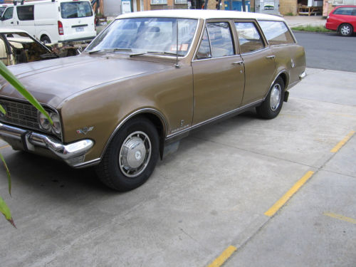 HT Holden in Kashmir White over Egyptian Bronze Met — Premier Sedan