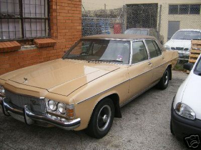 HX Holden in Sierra Tan Met over Buckskin — Statesamn Caprice Sedan