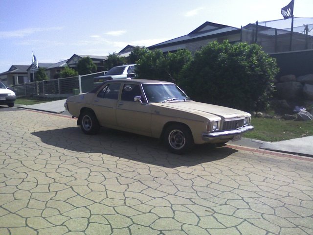 HX Holden in Sierra Tan Met over Buckskin — Kingswood Deluxe Sedan
