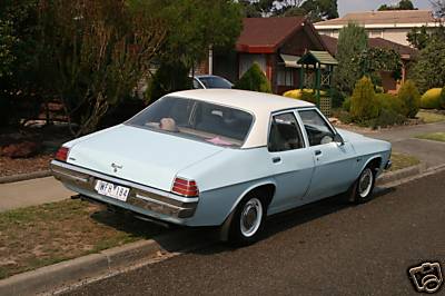 HZ Holden in Snowcrest White over Wedgwood Blue — Kingswood Sedan