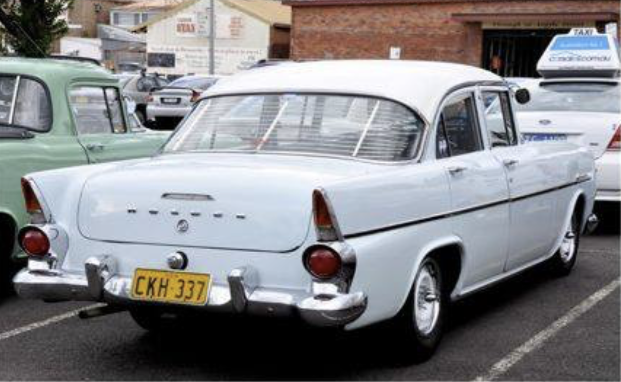 EK Holden in Snowcrest White over Cataract Grey — Special Sedan