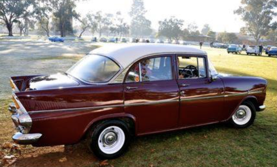 EK Holden in Snowcrest White over Grenadier Red — Special Sedan