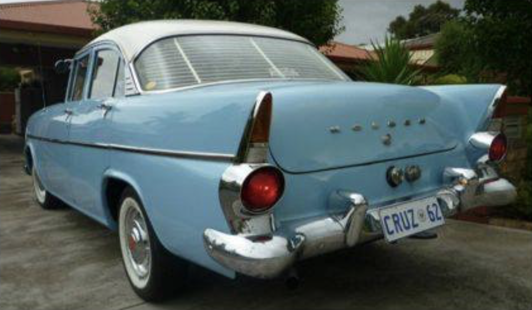 EK Holden in Snowcrest White over Strata Blue — Special Sedan