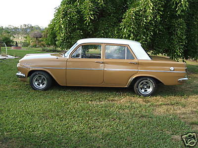 EH Holden in Fowlers Ivory over Kalgoorlie Gold — Special Sedan