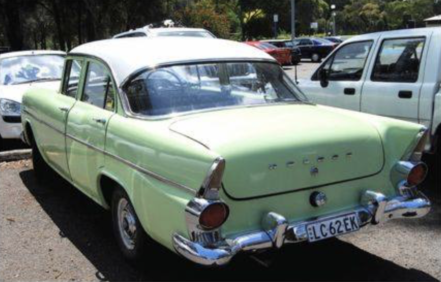 EK Holden in Snowcrest White over Castille Green — Special Sedan