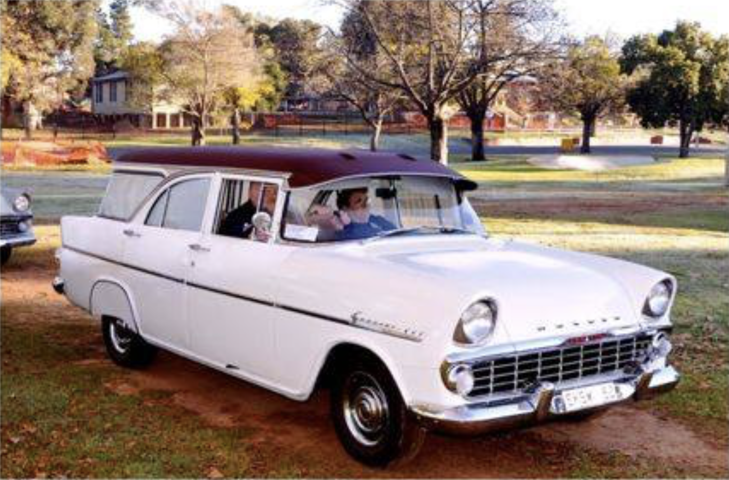 EK Holden in Mandang Maroon over Snowcrest White — Special Station Sedan