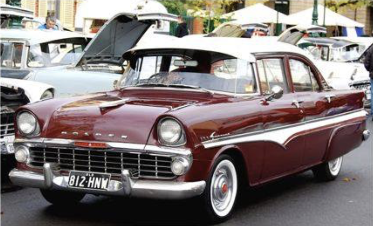 EK Holden in Snowcrest White over Mandang Maroon — Special Sedan