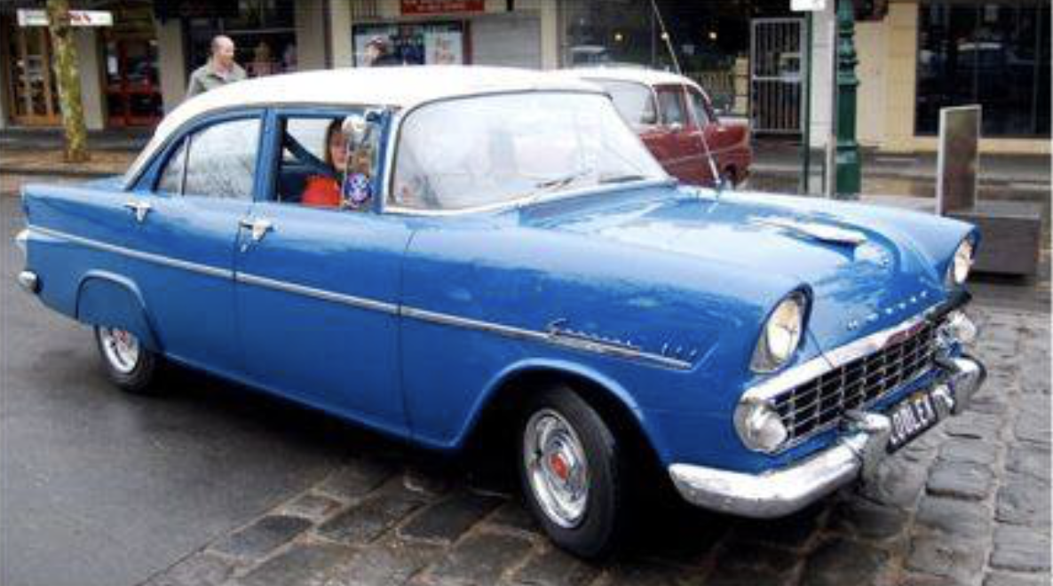FB Holden in Snowcrest White over Marine Blue — Special Sedan
