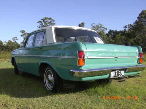 EH Holden in Fowlers Ivory over Mitta Green — Special Sedan