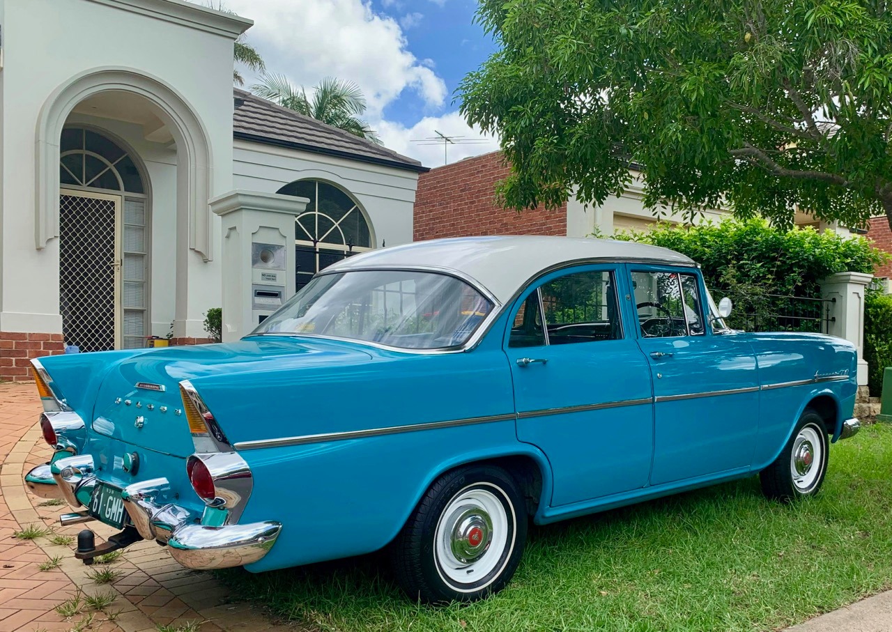 EK Holden in Snowcrest White over Twilight Turquoise — Special Sedan