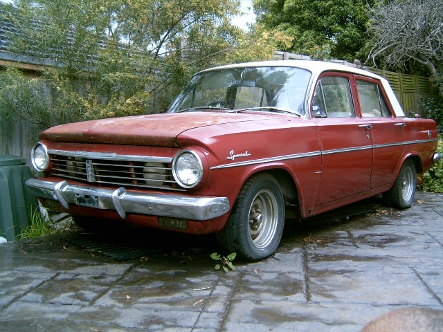 EH Holden in Fowlers Ivory over Winton Red — Special Sedan