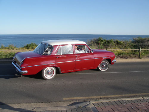 EJ Holden in Atherton Ivory over Namatjira Red — Special Sedan - Manual Transmission