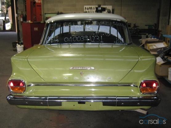 EJ Holden in Atherton Ivory over Sepik Green — Special Sedan - Manual Transmission