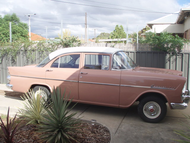 EK Holden in Snowcrest White over Egyptian Tan — Special Sedan