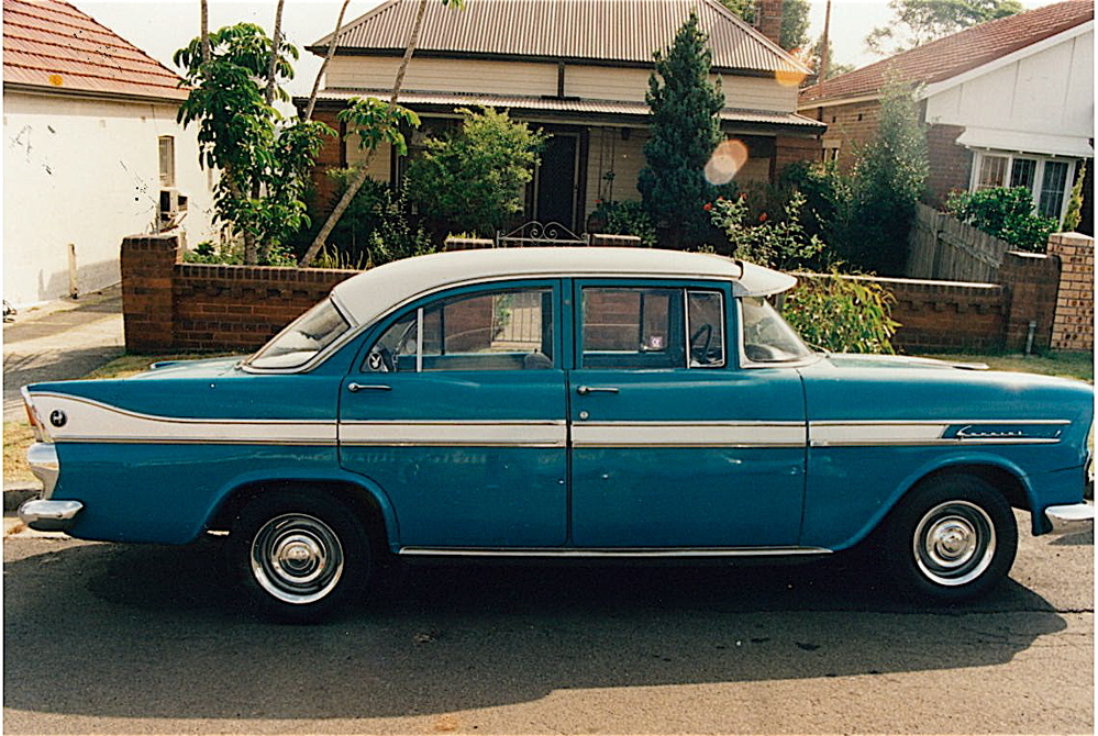 EK Holden in Snowcrest White over Twilight Turquoise — Special Sedan