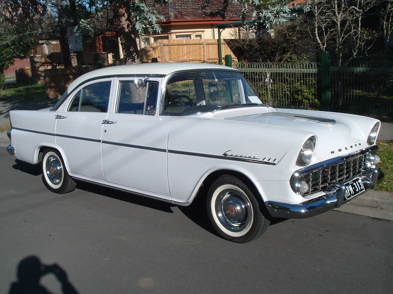 EK Holden in Snowcrest White over Parisian Lilac — Special Sedan