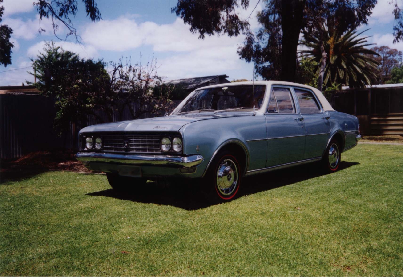 HG Holden in Kashmir White over Electra Blue Met — Premier Sedan