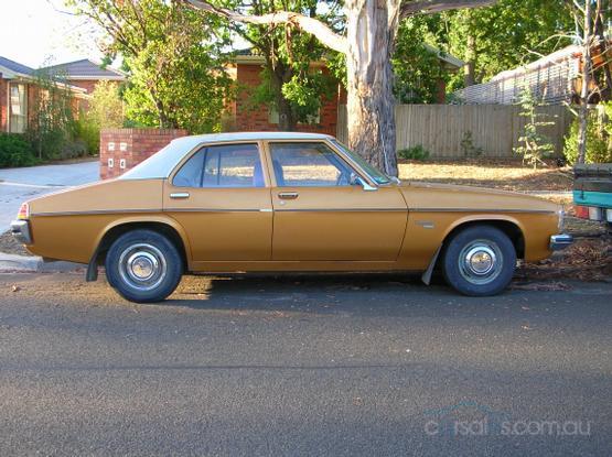 HJ Holden in Cotillion White over Contessa Gold Met — Kingswood Deluxe Sedan