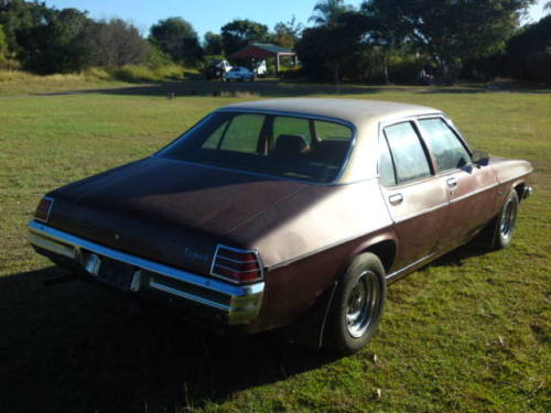 HJ Holden in Antelope Met over Claret Met — Kingswood Vacationer Sedan