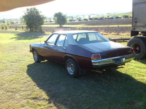 HJ Holden in Antelope Met over Claret Met — Kingswood Vacationer Sedan