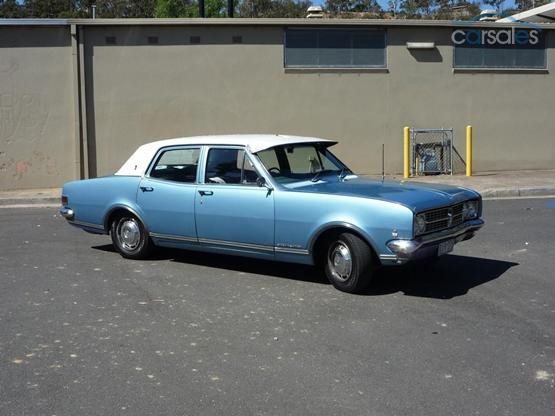 HK Holden in Ermine White over Hacienda Blue Metallic — Premier Sedan