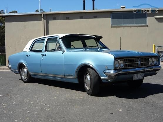 HK Holden in Ermine White over Hacienda Blue Metallic — Premier Sedan
