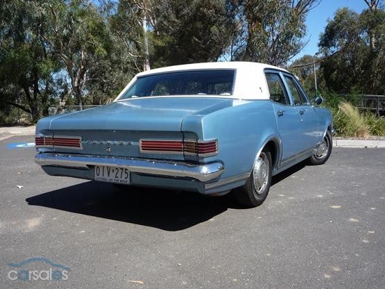 HK Holden in Ermine White over Hacienda Blue Metallic — Premier Sedan