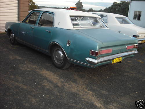 HK Holden in Grecian White over Tennyson Turquoise Met — Premier Sedan