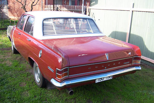 HD Holden in Fowlers Ivory over Sultan Red — Special Sedan